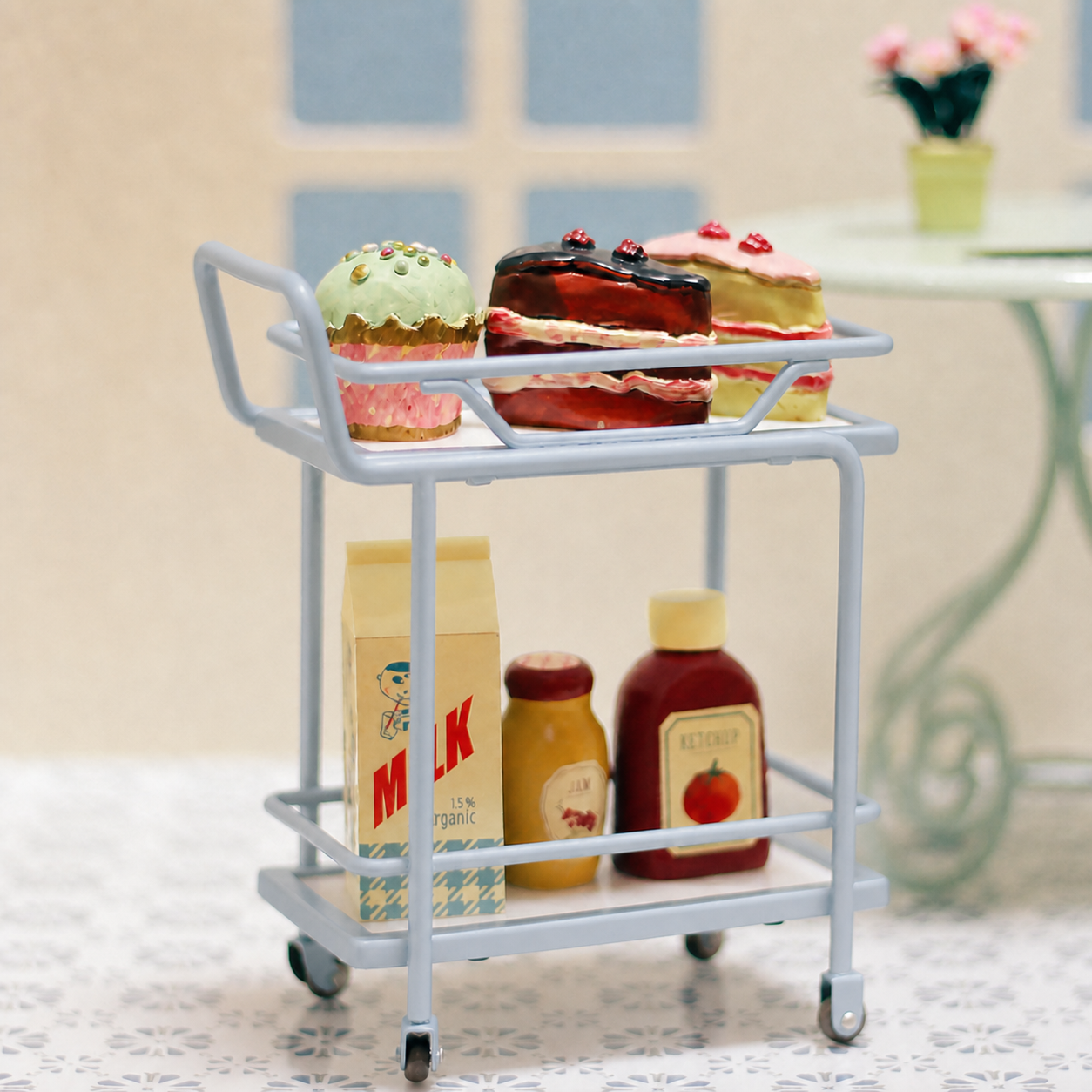 Muted blue 1:6 mother-of-pearl serving trolley styled with miniature cakes, milk carton and condiment bottles